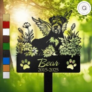 Personalized Airedale Terrier metal pet grave marker with angel wings and daisy flowers, displayed in a sunlit garden with color swatch options