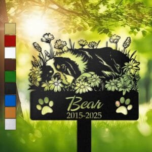 Personalized Bernese Mountain Dog metal pet grave marker in a sleeping pose surrounded by daisy flowers, displayed in a sunlit garden with color swatch options