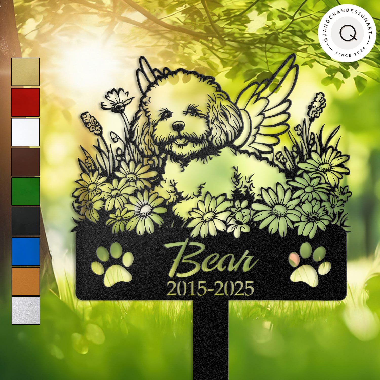 Personalized Bichon Frise metal pet grave marker with angel wings and daisy flowers, displayed in a sunlit garden with color swatch options