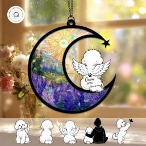 Crescent moon suncatcher with an angel-winged Bichon Frise silhouette over a warm sunset landscape