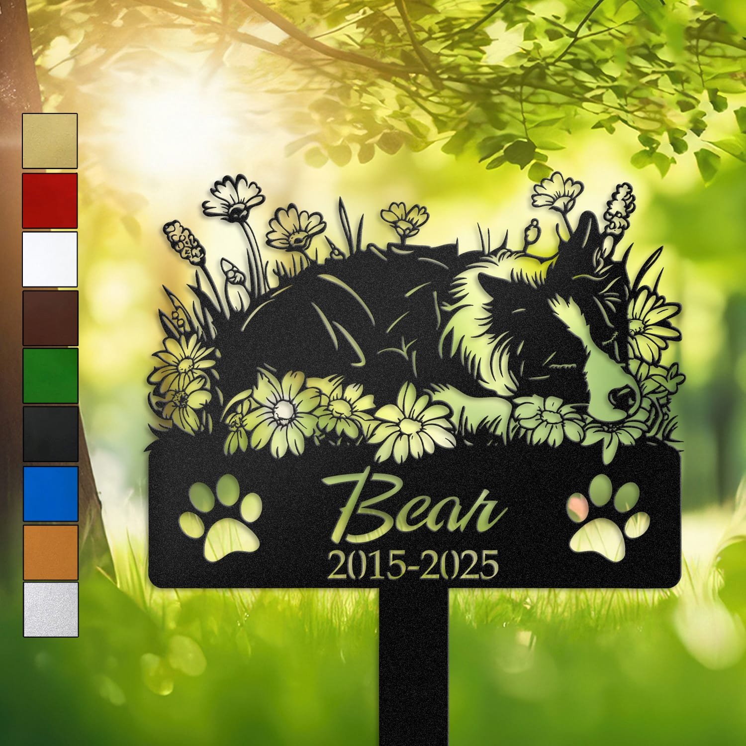 Personalized Border Collie metal pet grave marker in a sleeping pose surrounded by daisy flowers, displayed in a sunlit garden with color swatch options