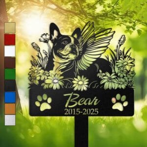 Personalized Boston Terrier metal pet grave marker with angel wings and daisy flowers, displayed in a sunlit garden with color swatch options