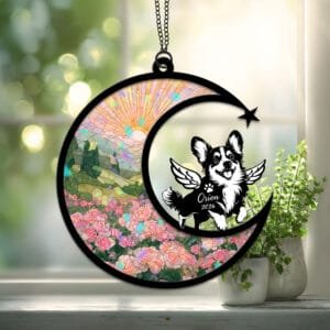 Crescent moon suncatcher with a playful Corgi silhouette reaching up toward a butterfly over a stained-glass rose garden