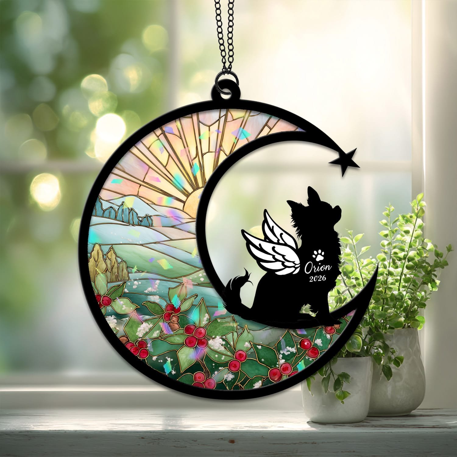 Crescent moon suncatcher with an angel-winged Long-Haired Chihuahua silhouette over a stained-glass holly and berry winter field