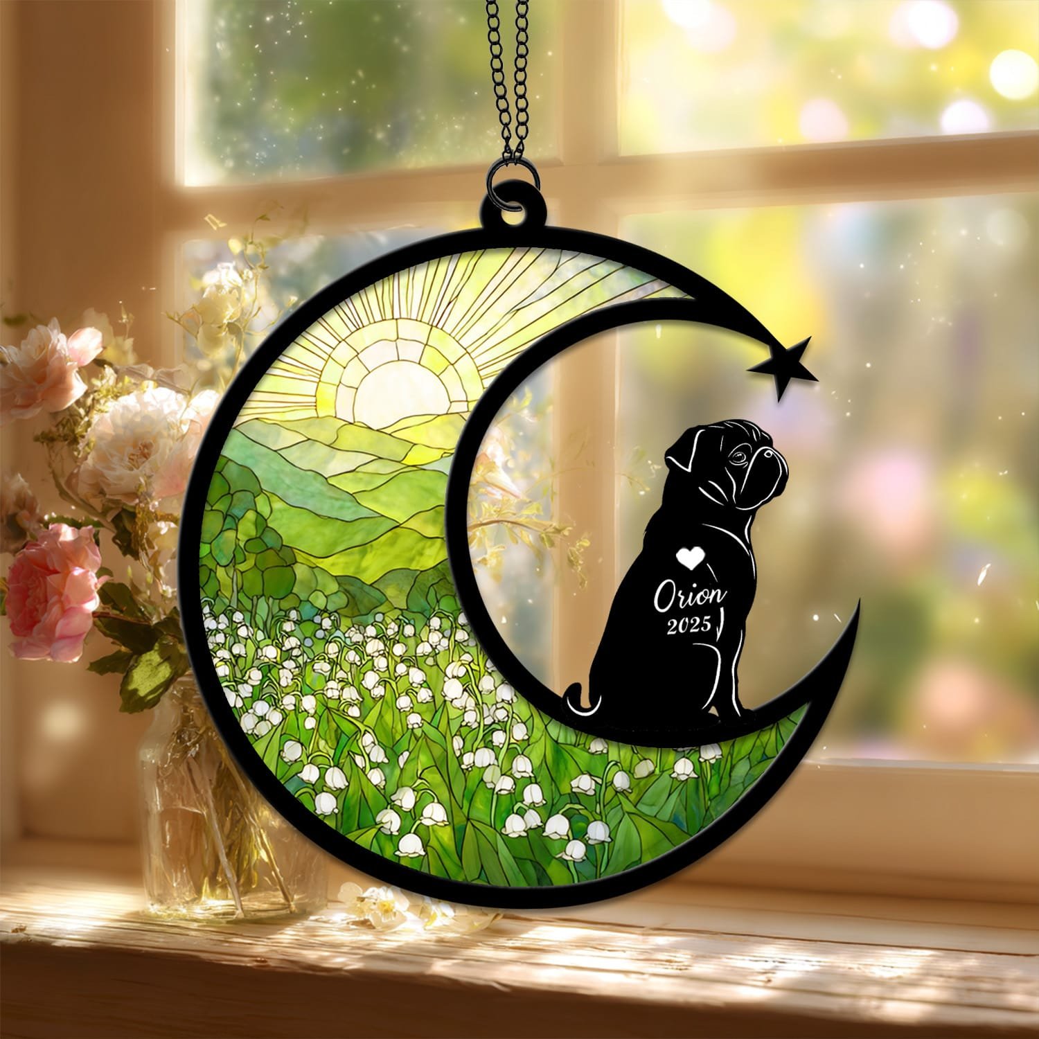 Standard style suncatcher showing a Pug silhouette seated on the crescent moon beside a stained-glass floral field