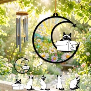 Siamese cat silhouette peeking out of a keepsake box on a stained-glass crescent moon wind chime suncatcher over a daisy field