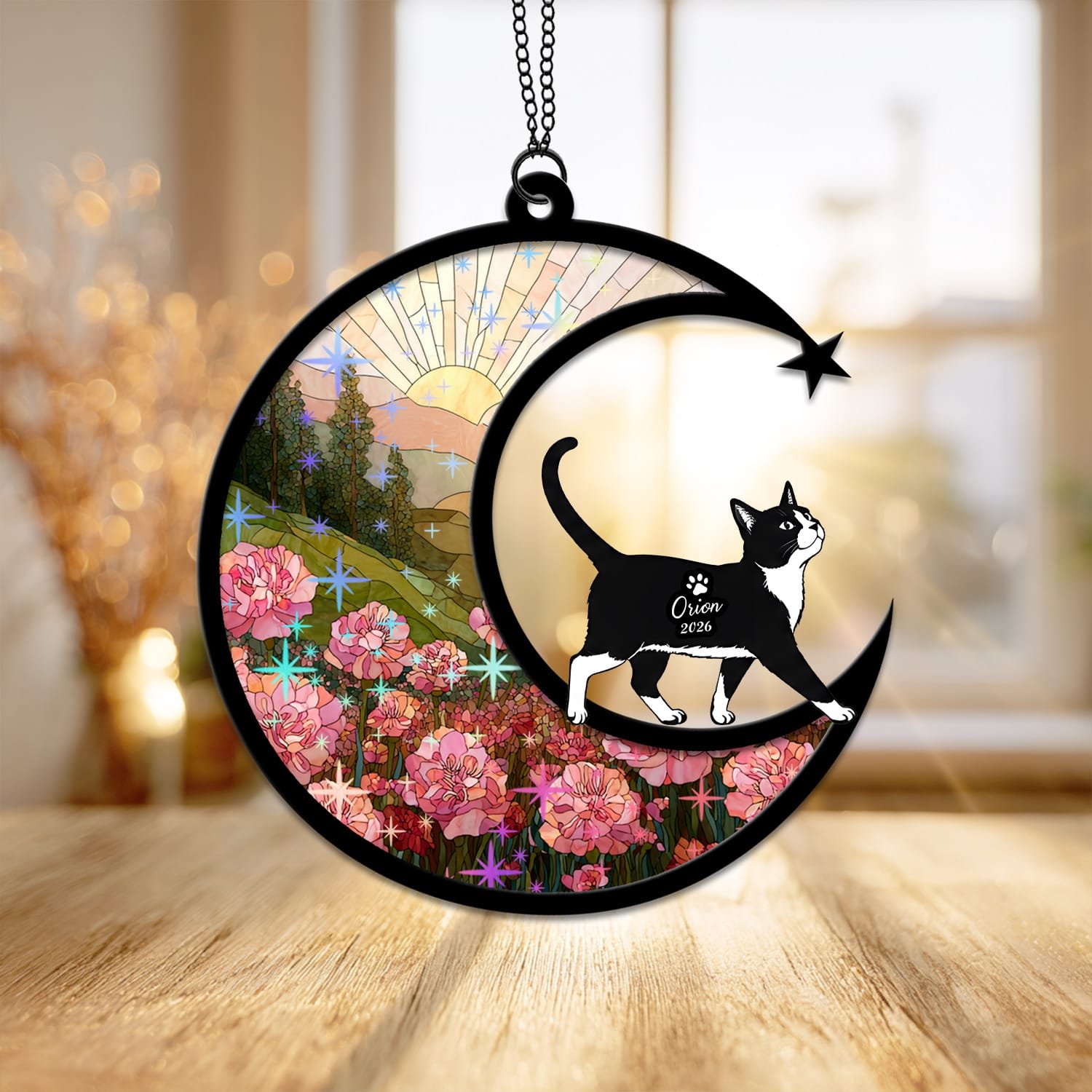 Starburst style suncatcher with a Tuxedo Cat silhouette under a sparkling stained-glass sunrise