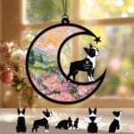 Crescent moon suncatcher with a standing Boston Terrier silhouette gazing at a shooting star over a stained-glass pink rose garden
