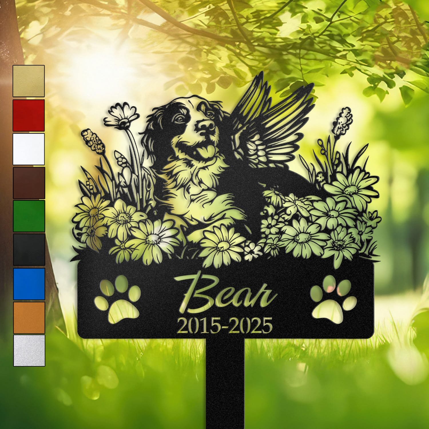Personalized Brittany Spaniel metal pet grave marker with angel wings and daisy flowers, displayed in a sunlit garden with color swatch options