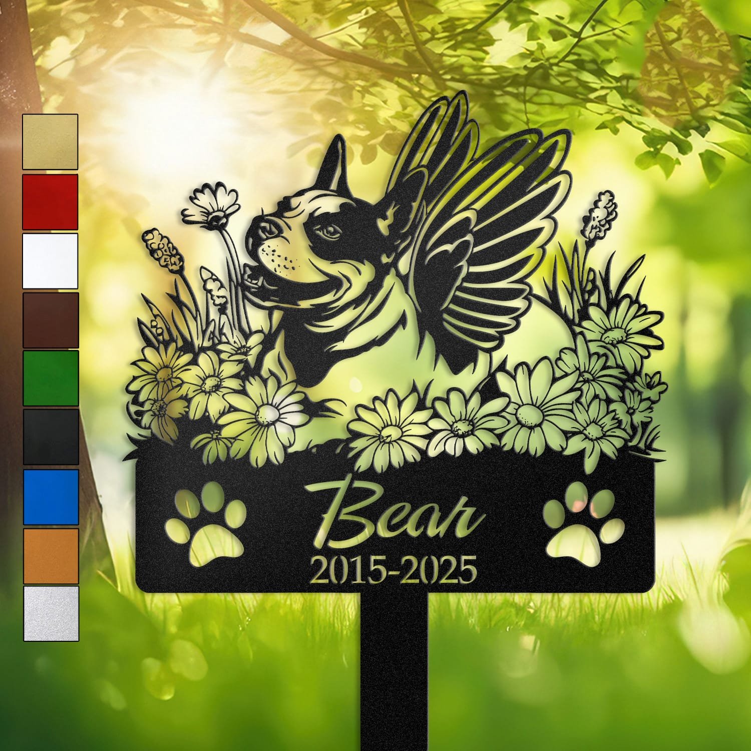 Personalized Bull Terrier metal pet grave marker with angel wings and daisy flowers, displayed in a sunlit garden with color swatch options