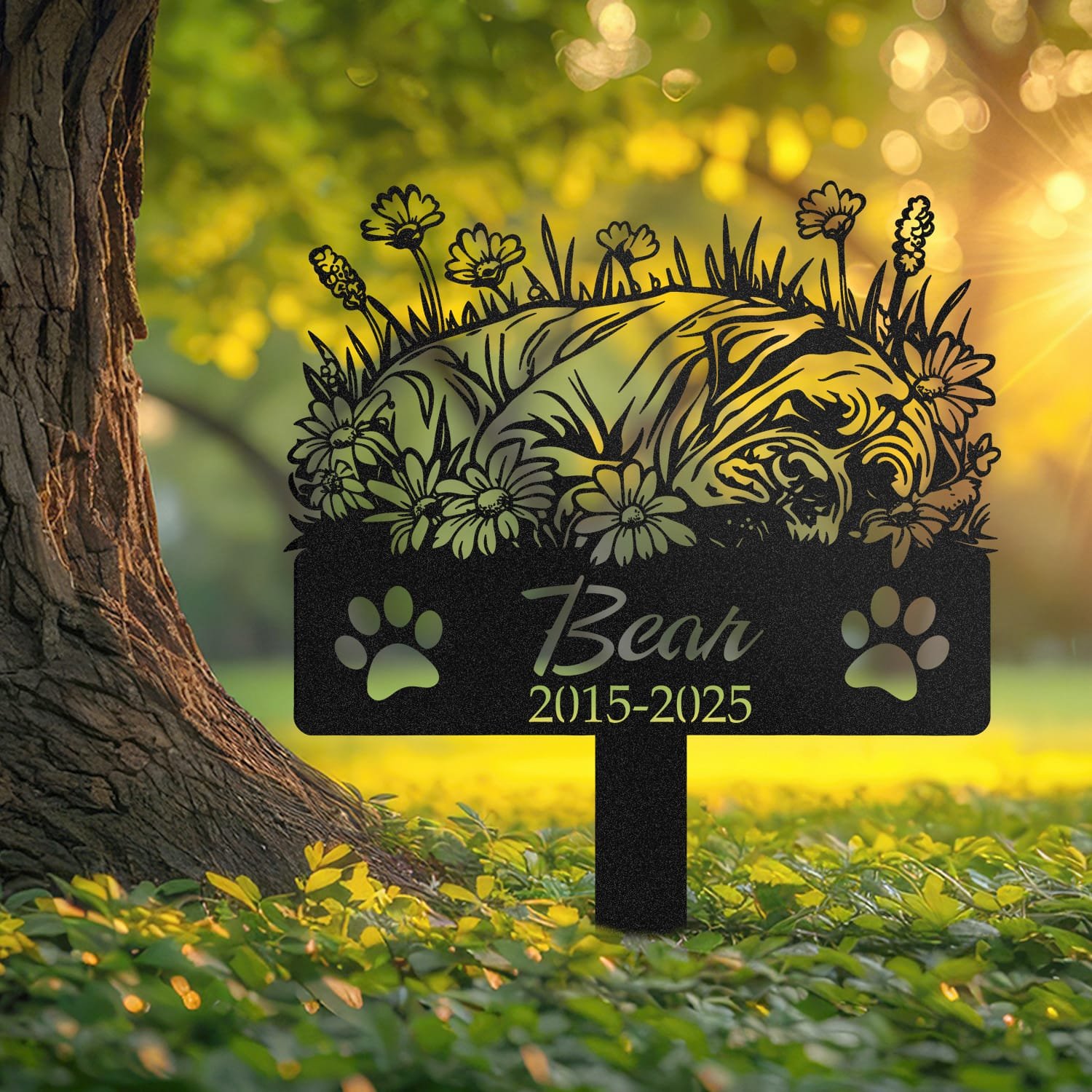 Cane Corso sleeping pose pet grave marker staked into the ground beside a large tree trunk in a garden setting