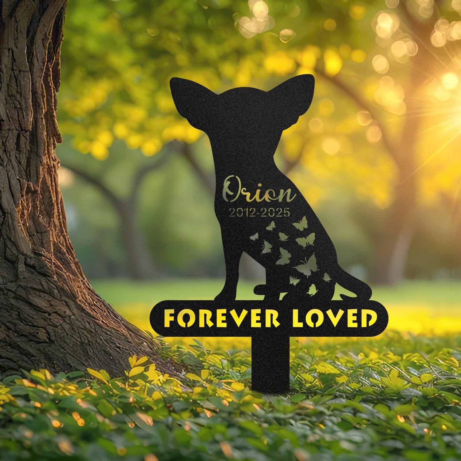 Chihuahua pet grave marker displayed outdoors in a garden setting, showing the personalized butterfly silhouette design with the 'Forever Loved' engraving in place on the stake.
