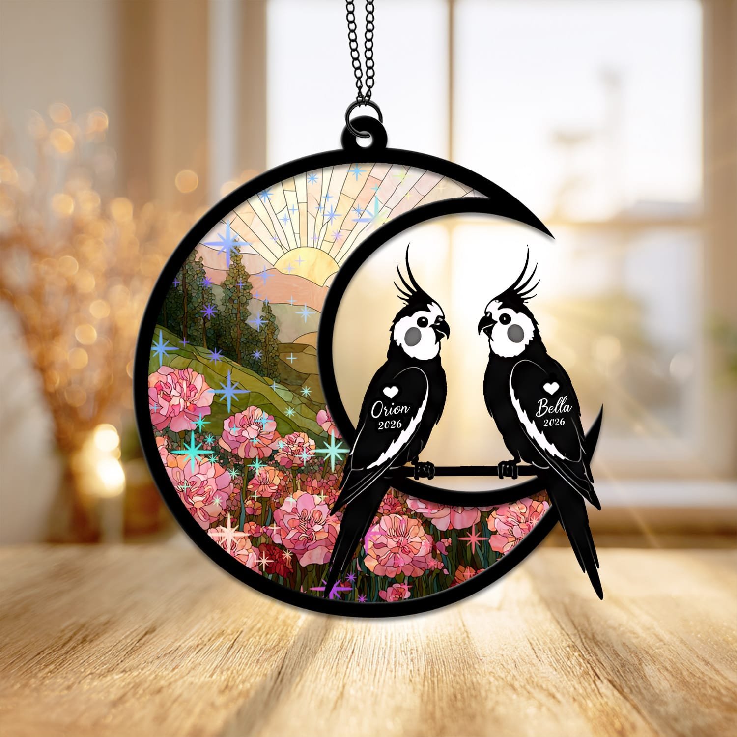 Starburst style suncatcher featuring a Cockatiel silhouette on a crescent moon with sparkling stained-glass sunrise and floral background