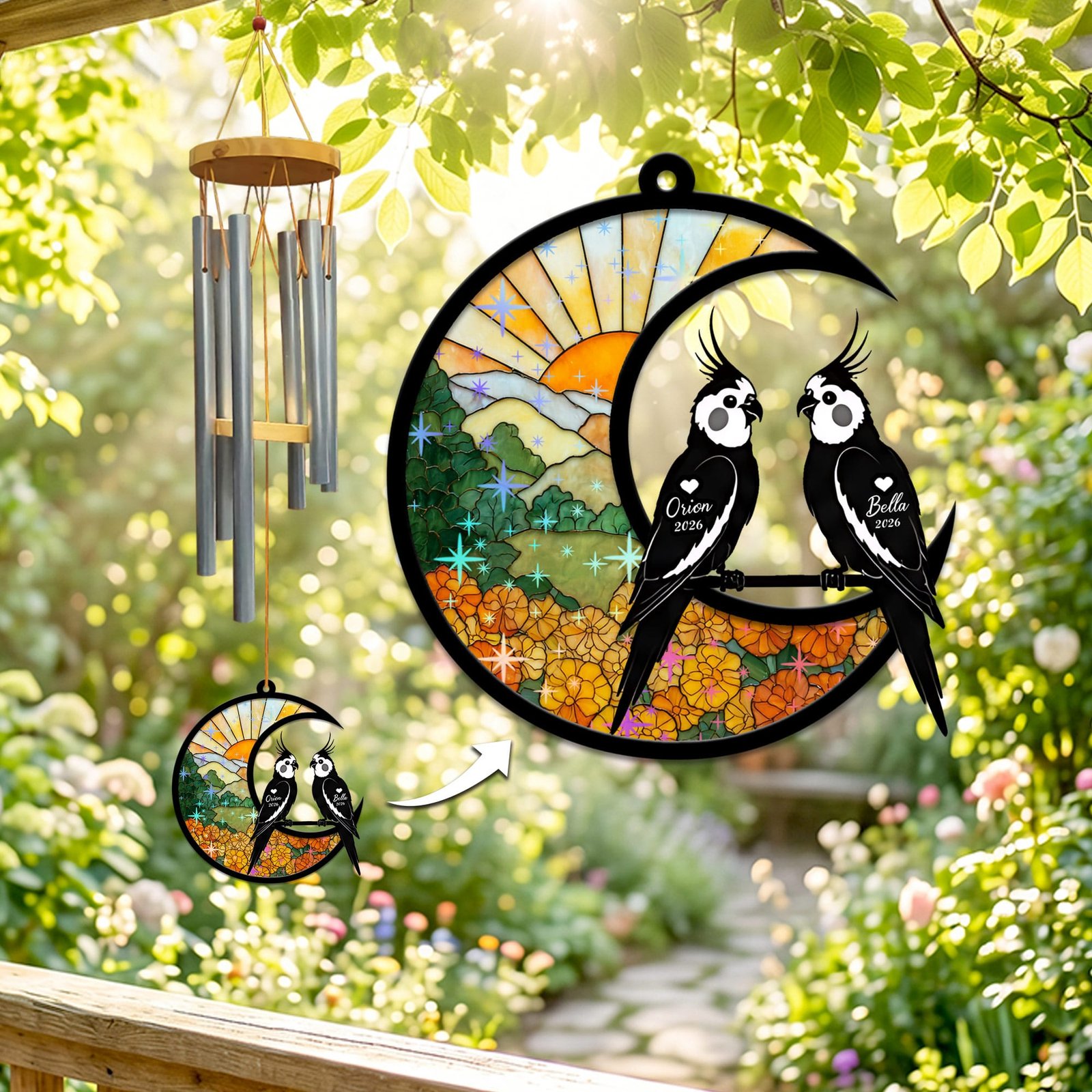 Stained-glass memorial wind chime suncatcher showing two cockatiel silhouettes perched together on a crescent moon over a marigold field at sunrise