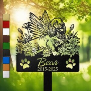 Personalized Cocker Spaniel metal pet grave marker with angel wings and daisy flowers, displayed in a sunlit garden with color swatch options
