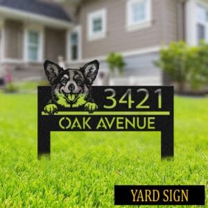 Personalized Corgi address sign on stakes in a grassy yard in front of a house, colored green and silver, reading 3421 Oak Avenue