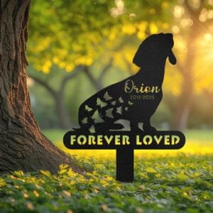 Dachshund silhouette with a trail of butterflies and a 'Forever Loved' engraving on a single-post personalized metal garden stake.