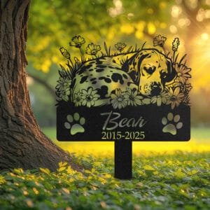 Personalized Dalmatian metal pet grave marker in a sleeping pose surrounded by daisy flowers, displayed in a sunlit garden with color swatch options