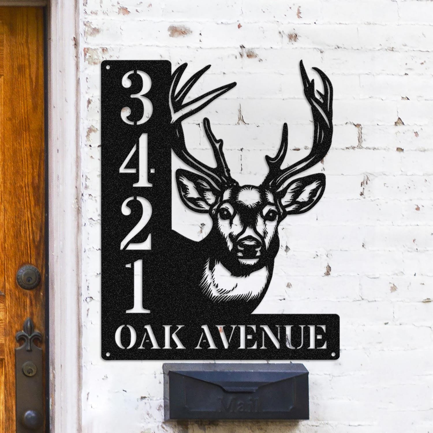 Personalized deer address sign with a buck's head and full antlers peeking over a vertical house number plaque reading 3421 Oak Avenue