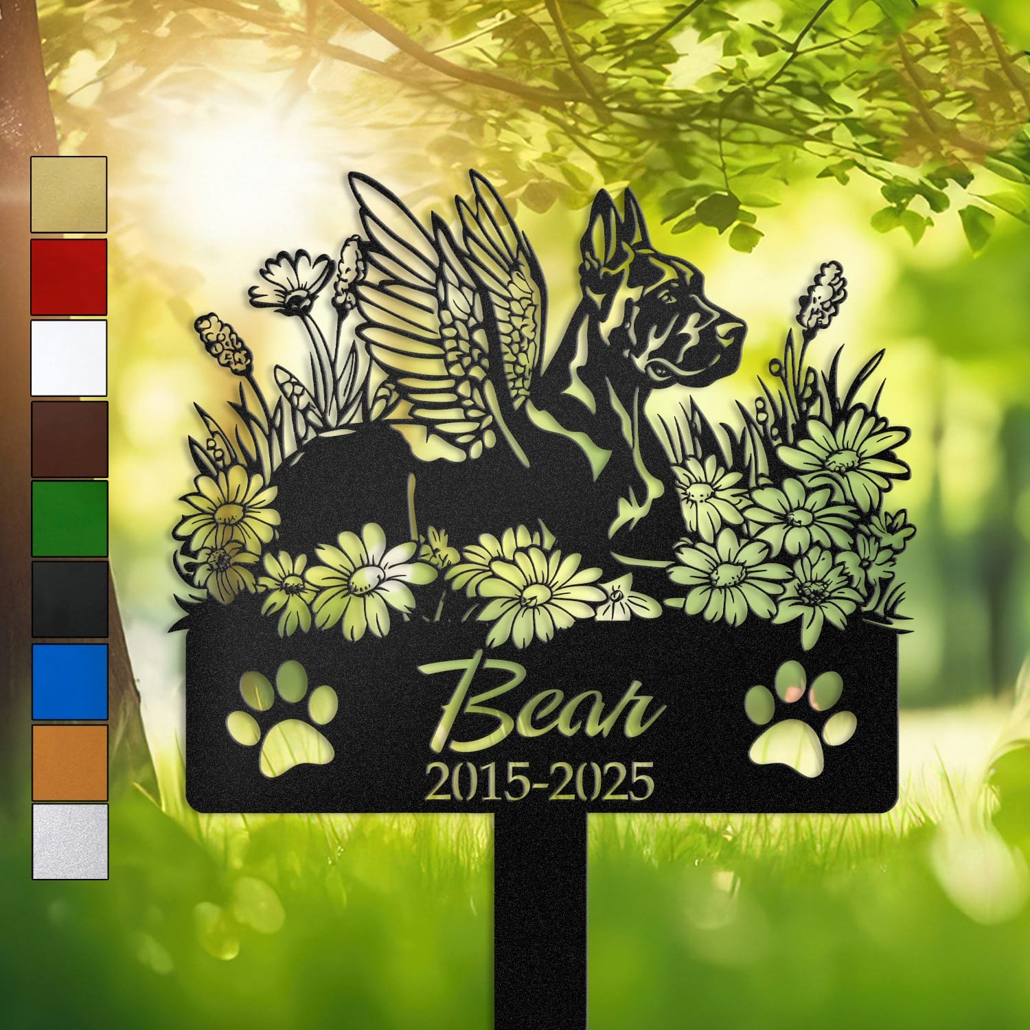Personalized Doberman metal pet grave marker with angel wings and daisy flowers, displayed in a sunlit garden with color swatch options