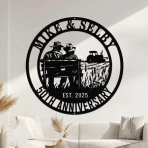 Metal wall art design of a farmer couple sitting together on a bench overlooking a field, with a tractor in the background, set within a circular frame reading the couple's names at the top and 'Anniversary' with the established year at the bottom, fully personalizable.