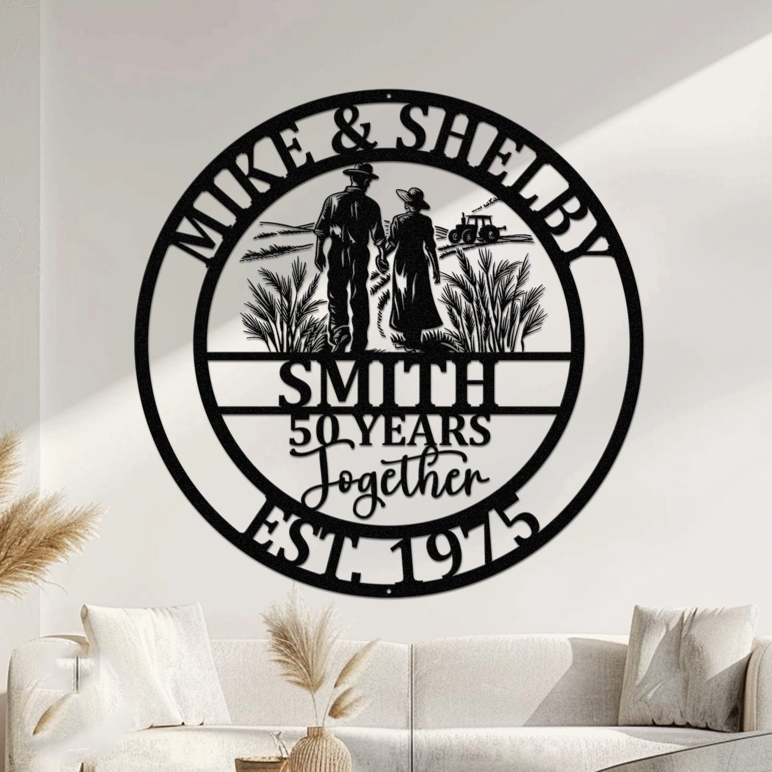 Metal wall art design of a farmer couple walking hand in hand away from the viewer through a field, with a tractor in the background, set within a circular frame reading the couple's names at the top and their last name, years together, and established year at the bottom, fully personalizable.
