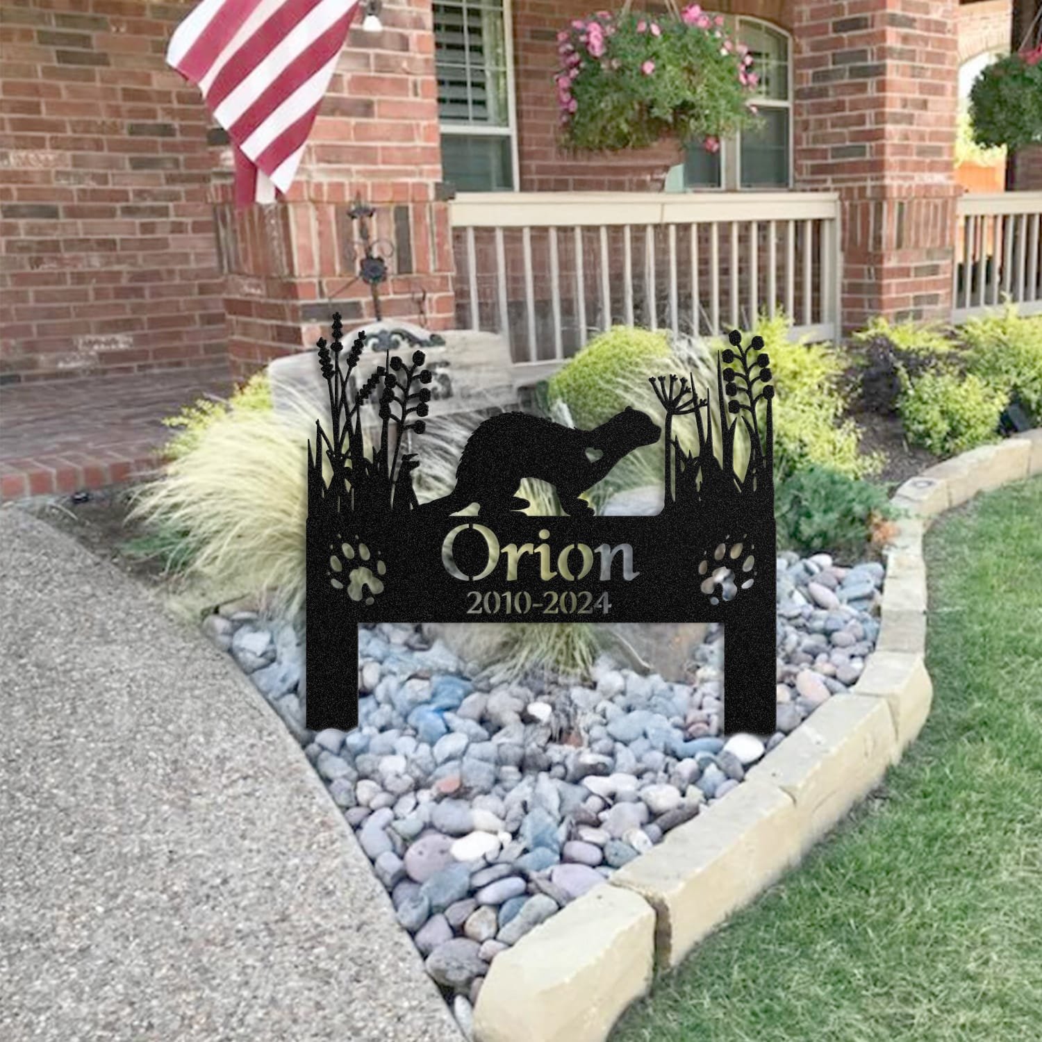Ferret pet grave marker staged near a home entryway, showing the finished heart-cutout silhouette design and name plate outdoors.