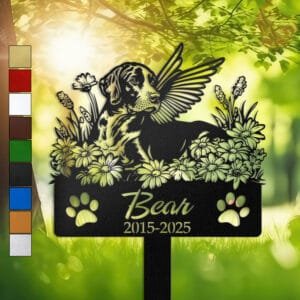 Personalized German Shorthaired Pointer metal pet grave marker with angel wings and daisy flowers, displayed in a sunlit garden with color swatch options