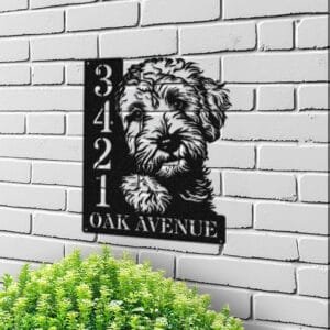 Personalized Goldendoodle address sign with a fluffy Goldendoodle face peeking over a vertical house number plaque reading 3421 Oak Avenue