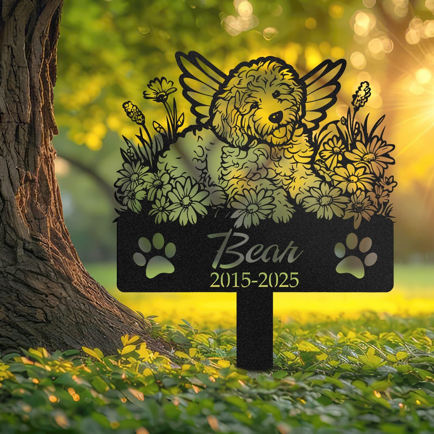 Goldendoodle pet grave marker displayed outdoors in a garden setting, showing the personalized angel wings and daisy floral design in place on the stake.