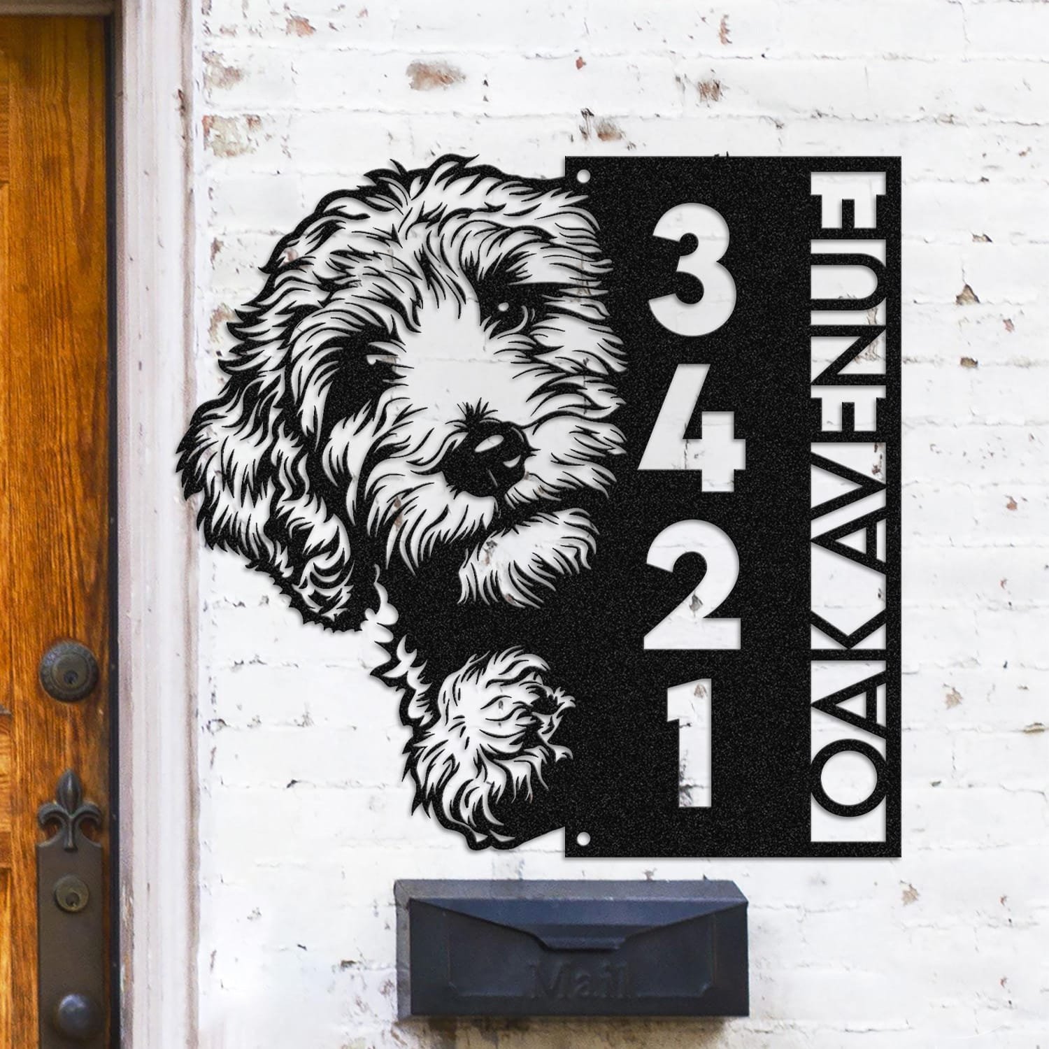 Goldendoodle address sign mounted on a light brick wall in a street-facing view
