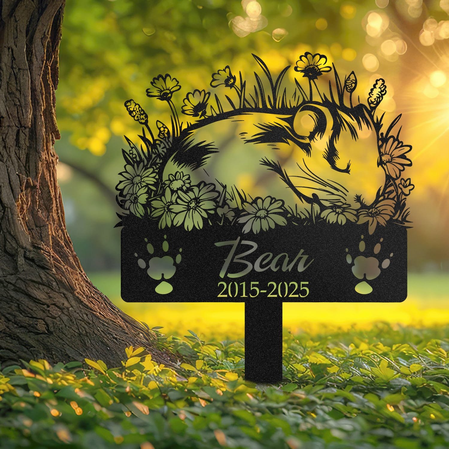 Guinea Pig pet grave marker displayed outdoors in a garden setting, showing the personalized sleeping-pose daisy floral design in place on the stake.