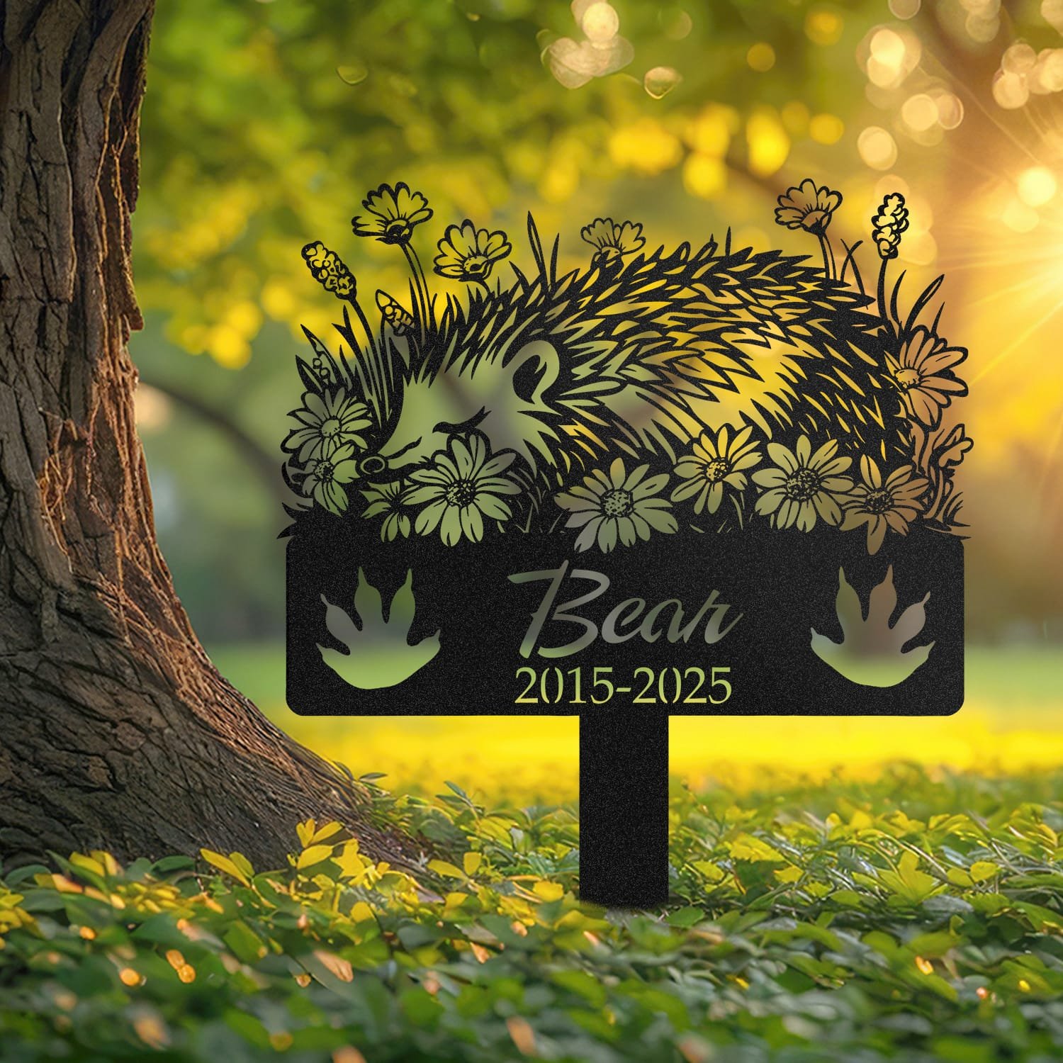 Hedgehog pet grave marker displayed outdoors in a garden setting, showing the personalized sleeping-pose daisy floral design in place on the stake.