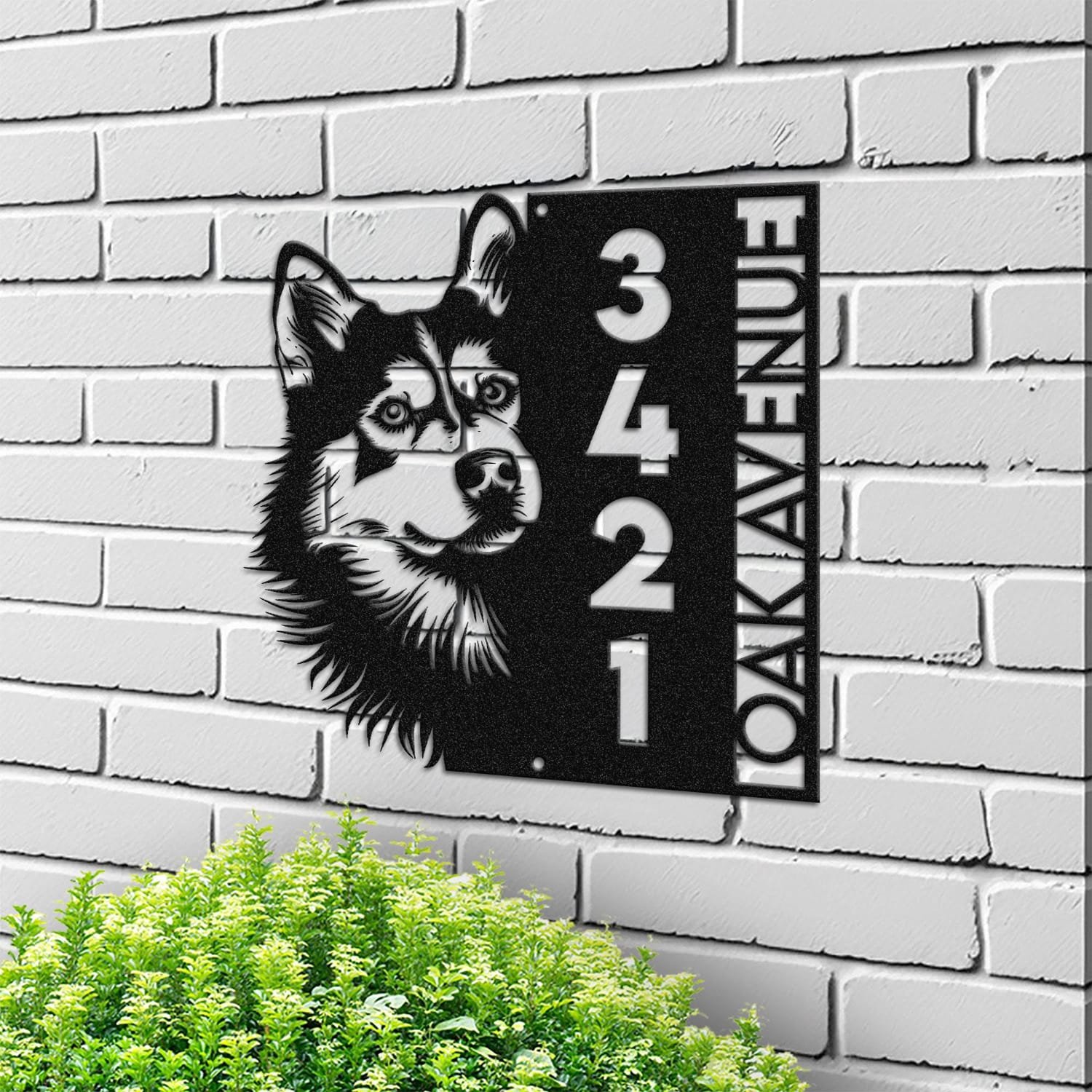 Husky address sign mounted on a light brick wall in a street-facing view