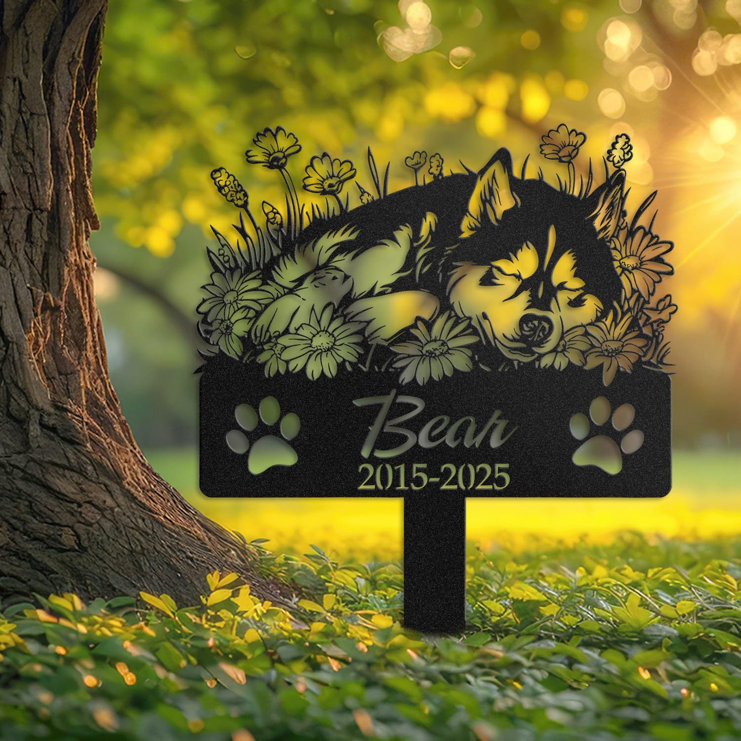 Husky pet grave marker displayed outdoors in a garden setting, showing the personalized sleeping-pose daisy floral design in place on the stake.