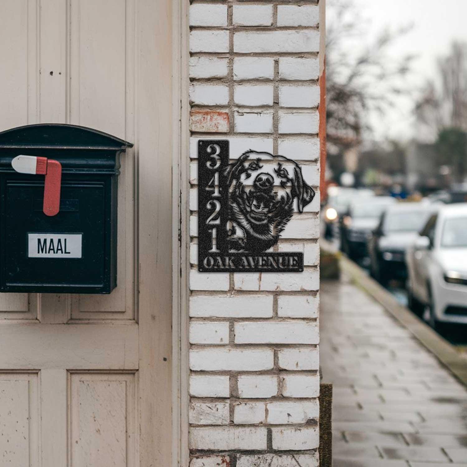 Labrador address sign mounted on a brick pillar near a mailbox and front door