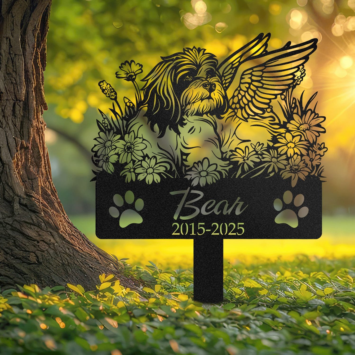 Lhasa Apso pet grave marker displayed outdoors in a garden setting, showing the personalized angel wings and daisy floral design in place on the stake.