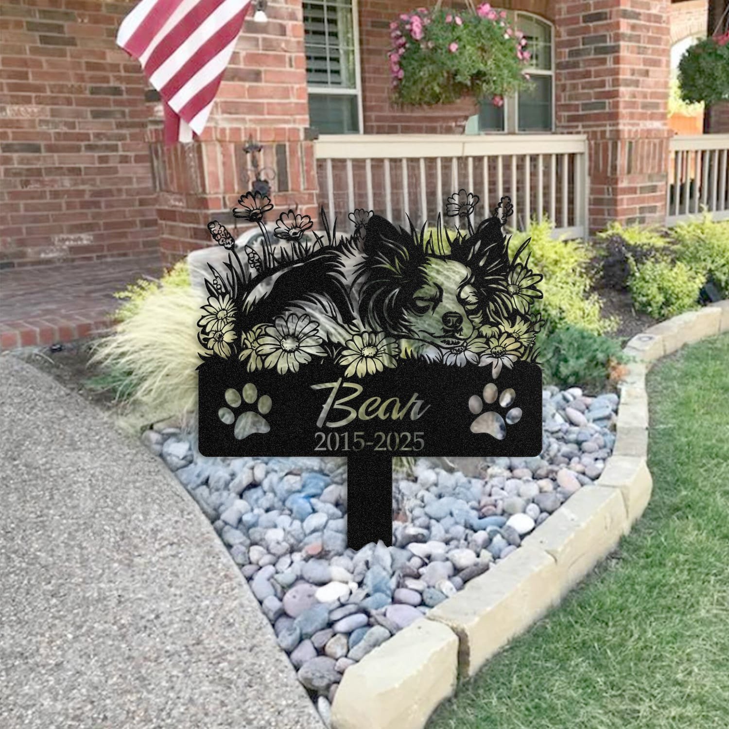 Long Hair Chihuahua pet grave marker staged near a home entryway, showing the finished sleeping-pose daisy floral design and name plate outdoors.