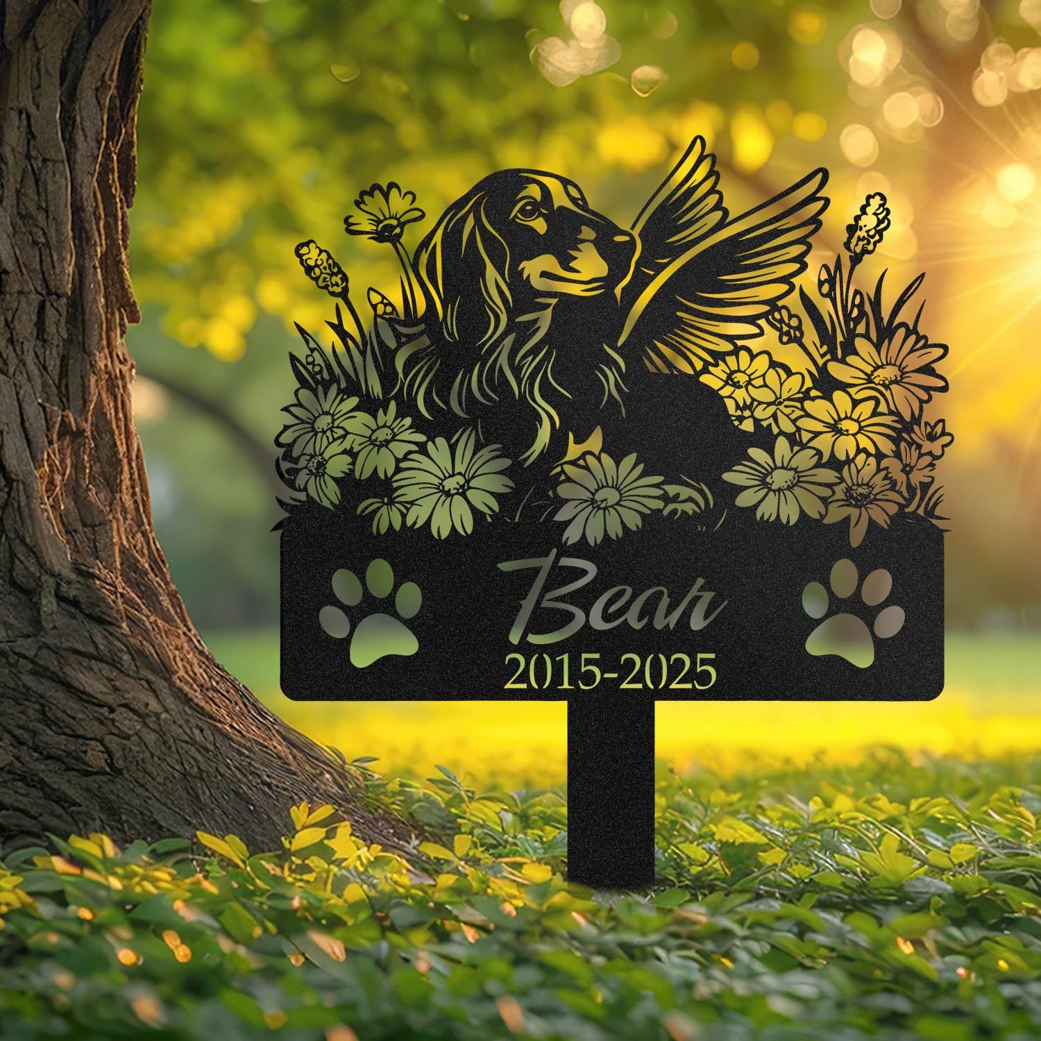 Long Hair Dachshund pet grave marker displayed outdoors in a garden setting, showing the personalized angel wings and daisy floral design in place on the stake.