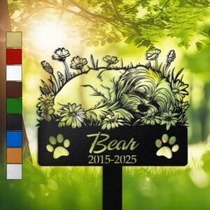 Maltese resting in a peaceful sleeping pose within a daisy floral border on a personalized metal garden stake, with paw print cutouts at the base.