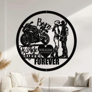 Metal wall art design of a couple in riding gear kissing beside a cruiser motorcycle, framed by the phrase 'Born To Ride Together Forever' with a heart cutout to personalize the couple's name and a special date.