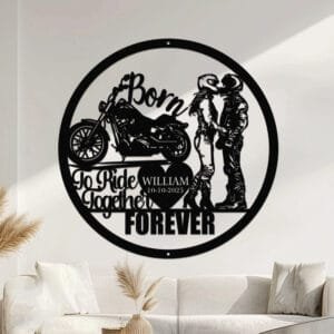 Metal wall art design of a couple in riding gear kissing beside a sport motorcycle, framed by the phrase 'Born To Ride Together Forever' with a heart cutout to personalize the couple's name and a special date.