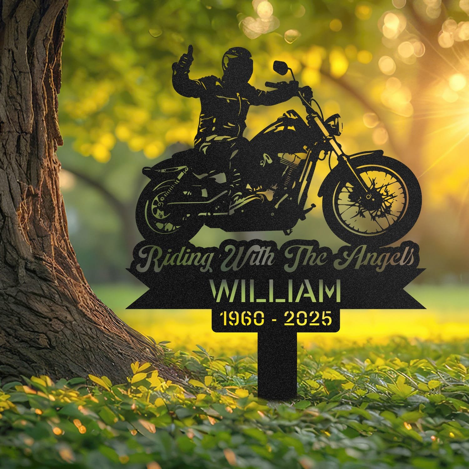 Motorcycle human grave marker displayed outdoors in a garden setting, showing the personalized motorcycle rider silhouette design in place on the stake.