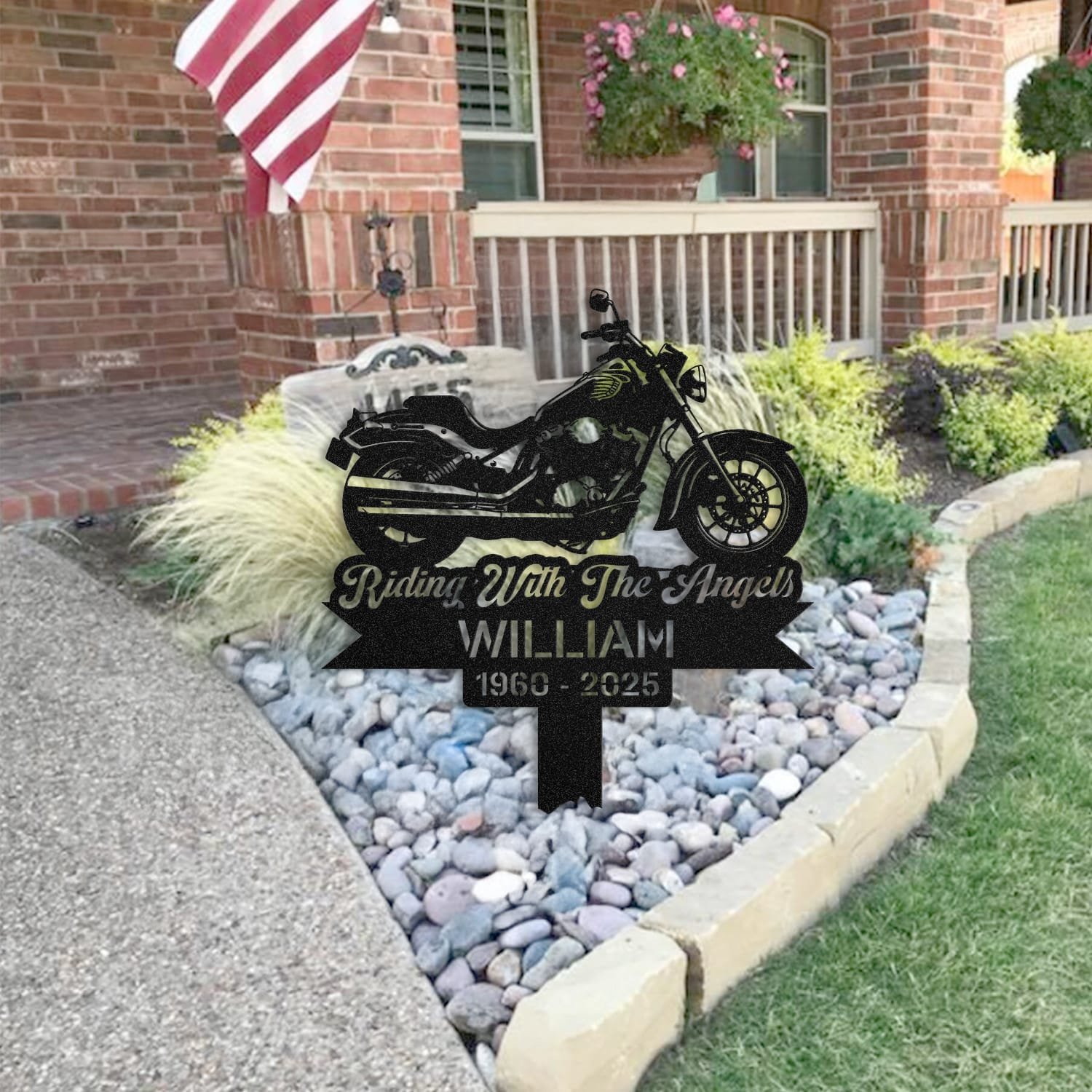 Motorcycle human grave marker staged near a home entryway, showing the finished motorcycle classic silhouette design and name plate outdoors.