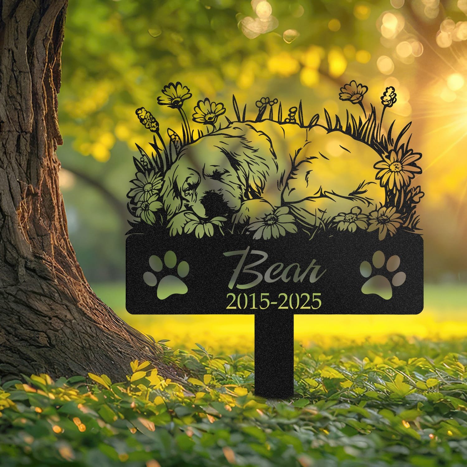 Newfoundland pet grave marker displayed outdoors in a garden setting, showing the personalized sleeping-pose daisy floral design in place on the stake.