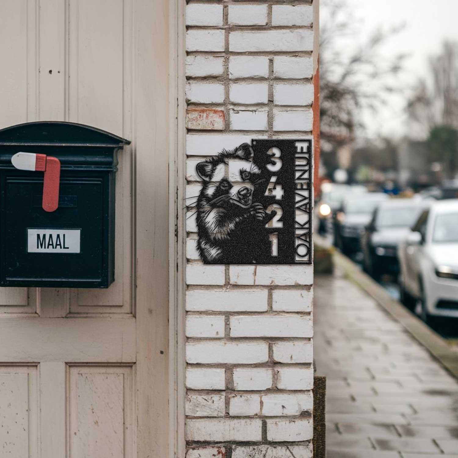 Opossum address sign mounted on a brick pillar near a mailbox and front door