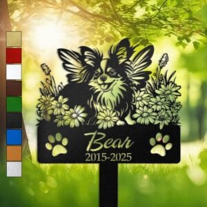 Papillon silhouette with angel wings surrounded by a daisy floral border on a personalized metal garden stake, with paw print cutouts at the base.