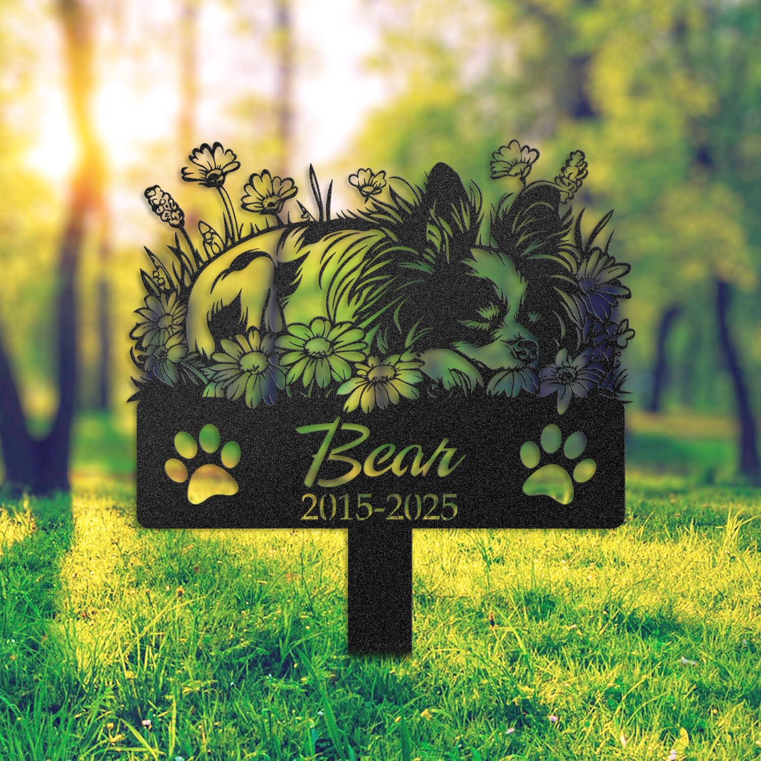 Papillon pet grave marker staged near a home entryway, showing the finished sleeping-pose daisy floral design and name plate outdoors.