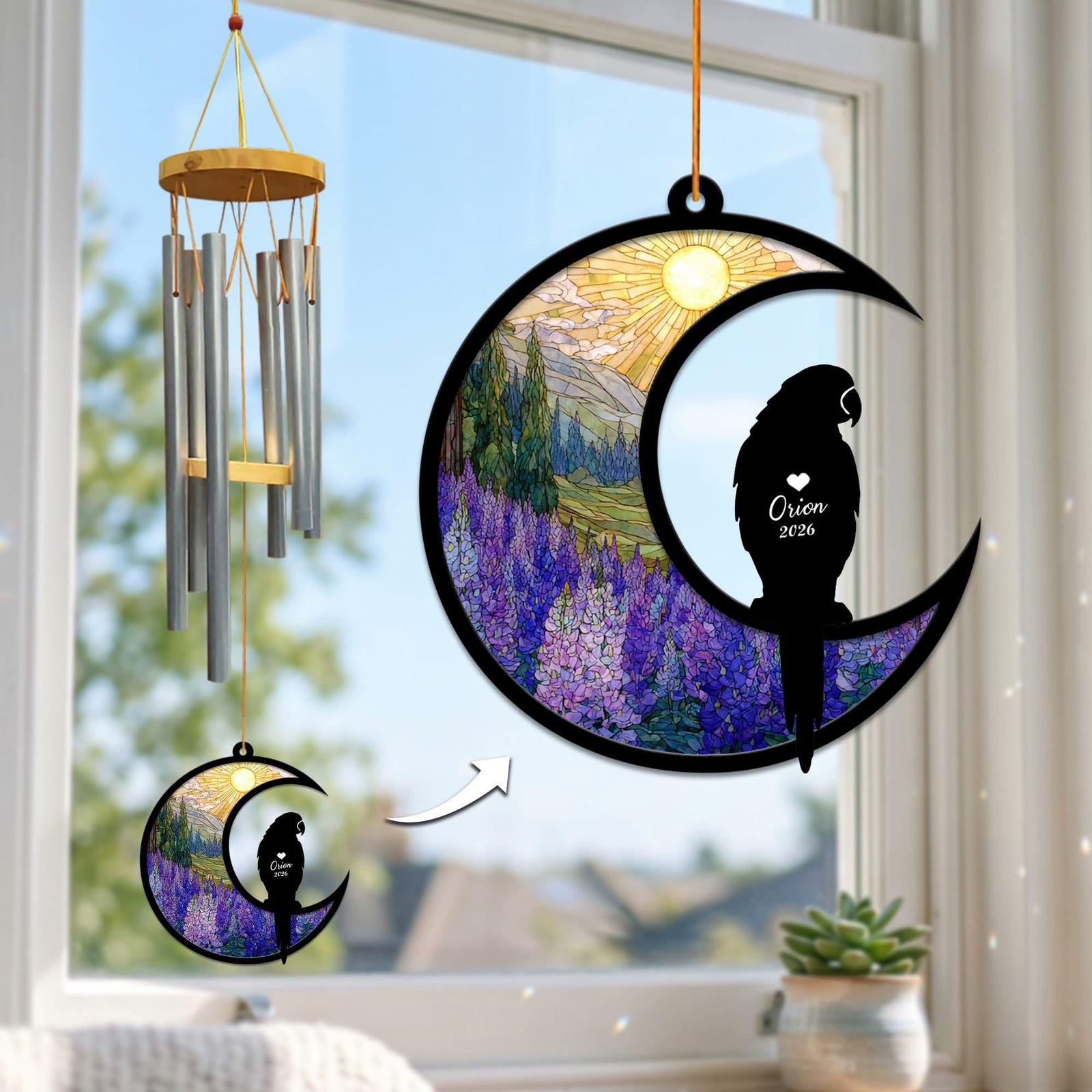 Stained-glass memorial wind chime suncatcher showing a parrot silhouette perched on a crescent moon over a purple lupine field, hanging in a sunny window