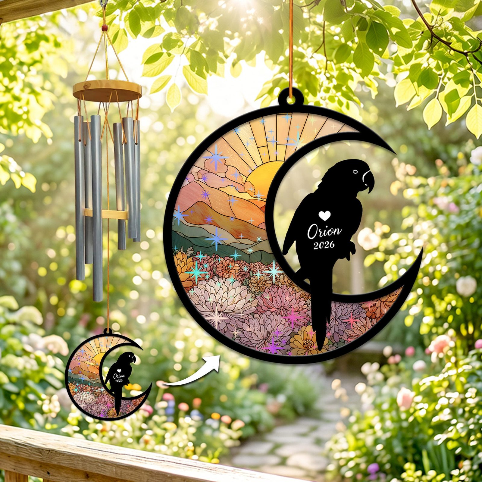Stained-glass memorial wind chime suncatcher showing a parrot silhouette perched on a crescent moon over chrysanthemums with sparkling star accents